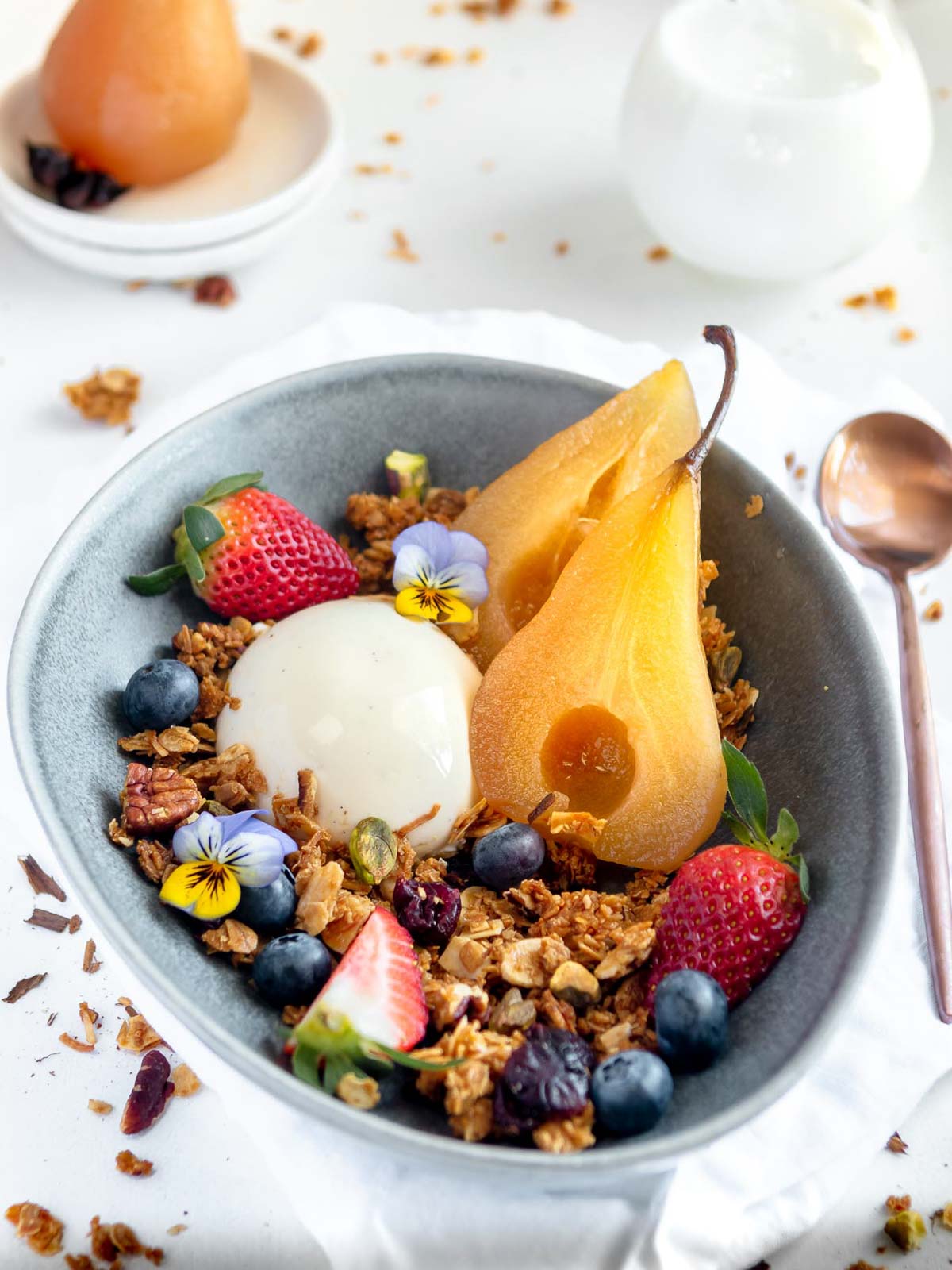 Vanilla poached pears served with homemade granola.