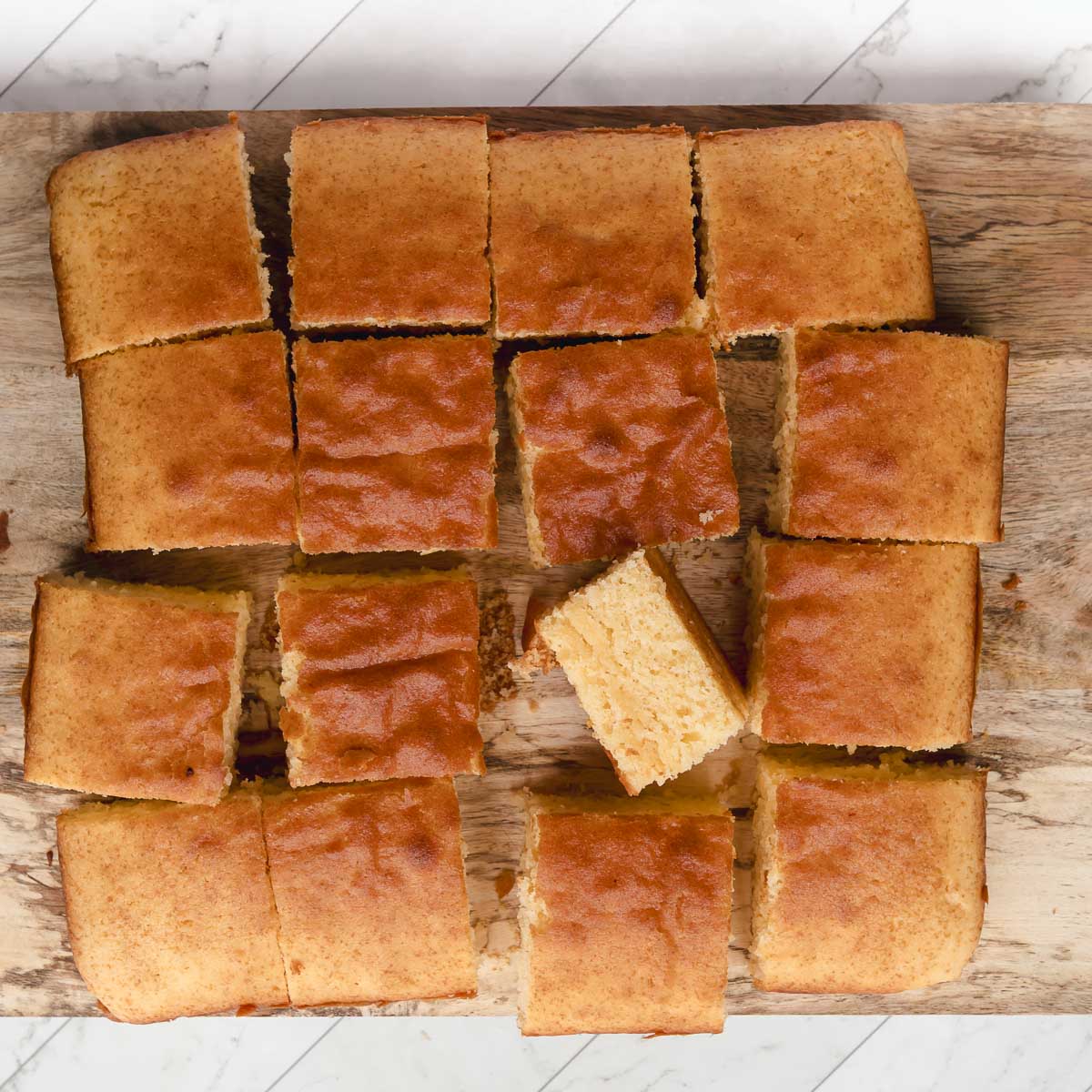 Cut the butter cake into squares to dip into the chocolate glaze.