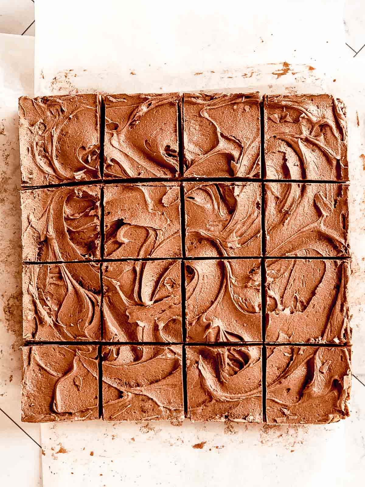 Hedgehog slice, topped with chocolate frosting and sliced into 16 squares.