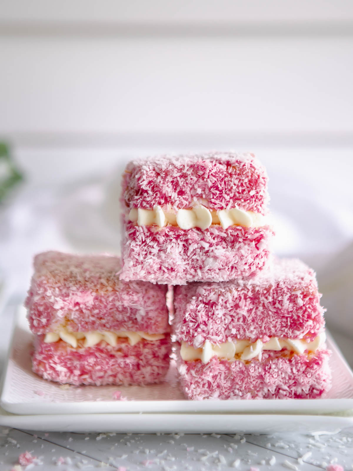 Pink lamingtons filled with chantilly cream.