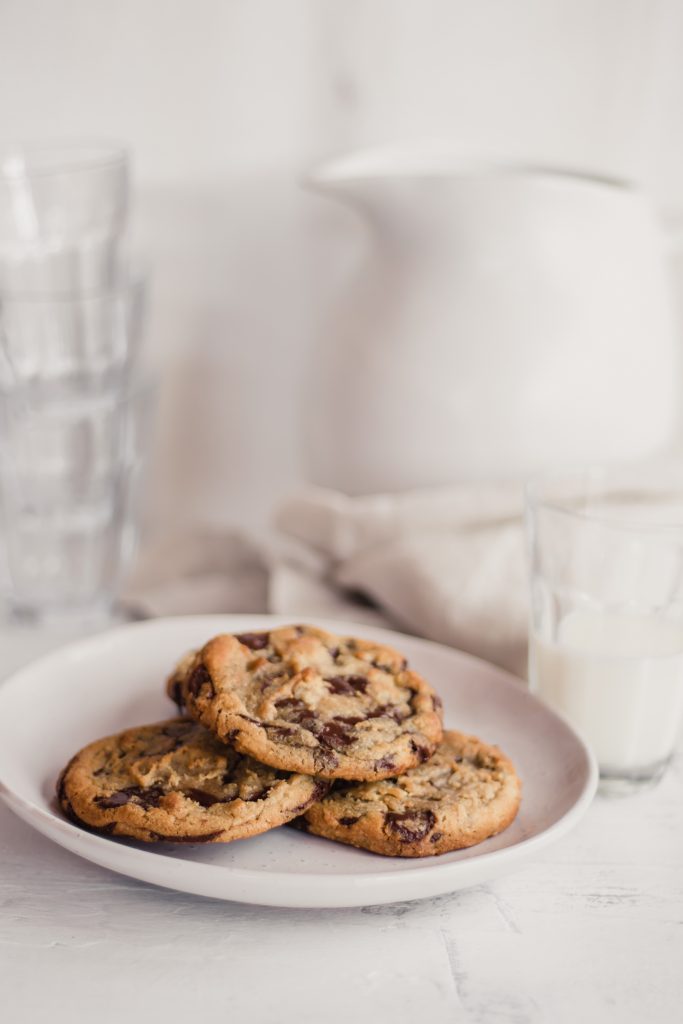 3 chocolate chip cookies on a white plate