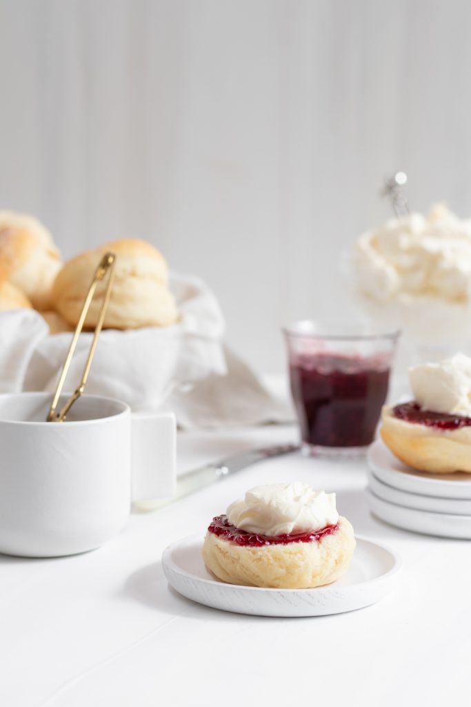 serving lemonade scones with jam and chantilly cream