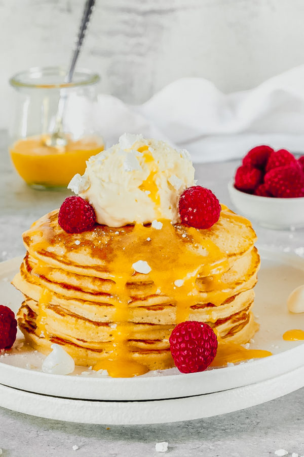 hotcakes topped with cream lemon curd