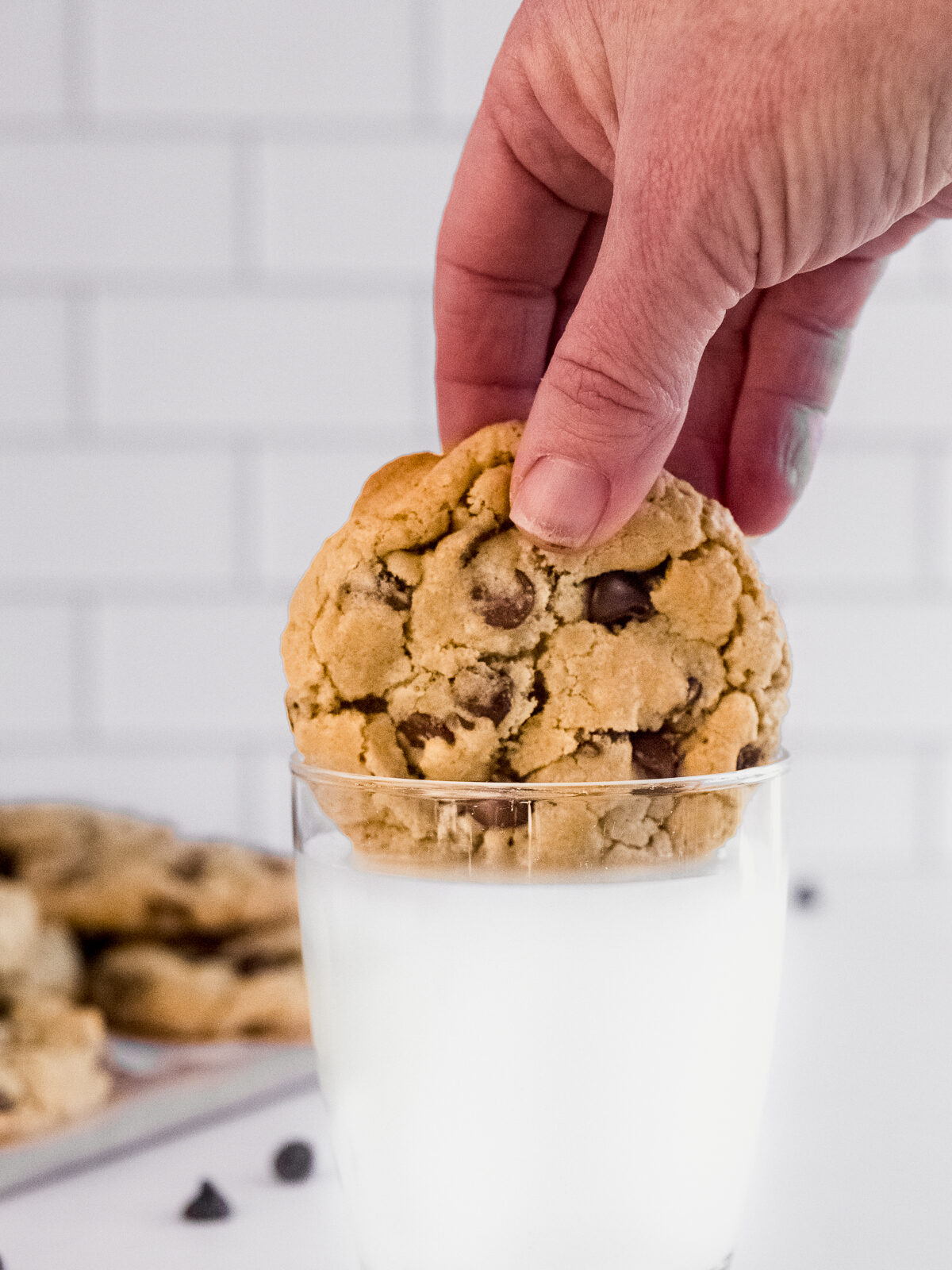 Dipping my favourite no chill chocolate chip cookie into a glass of milk.