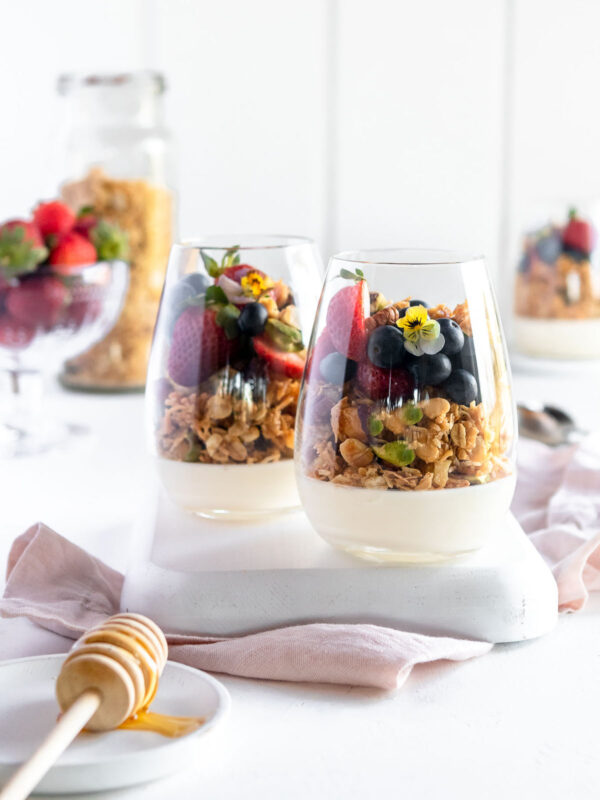 2 glasses of honey baked granola served over vanilla panna cotta