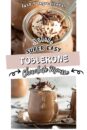 Toblerone mousse served in a small glass jar, topped with whipped cream and chocolate shavings.