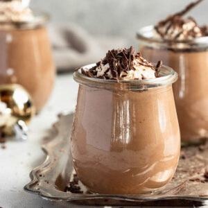Light and airy no-bake Toblerone mousse in glass jars, ready to serve as an easy make-ahead dessert.