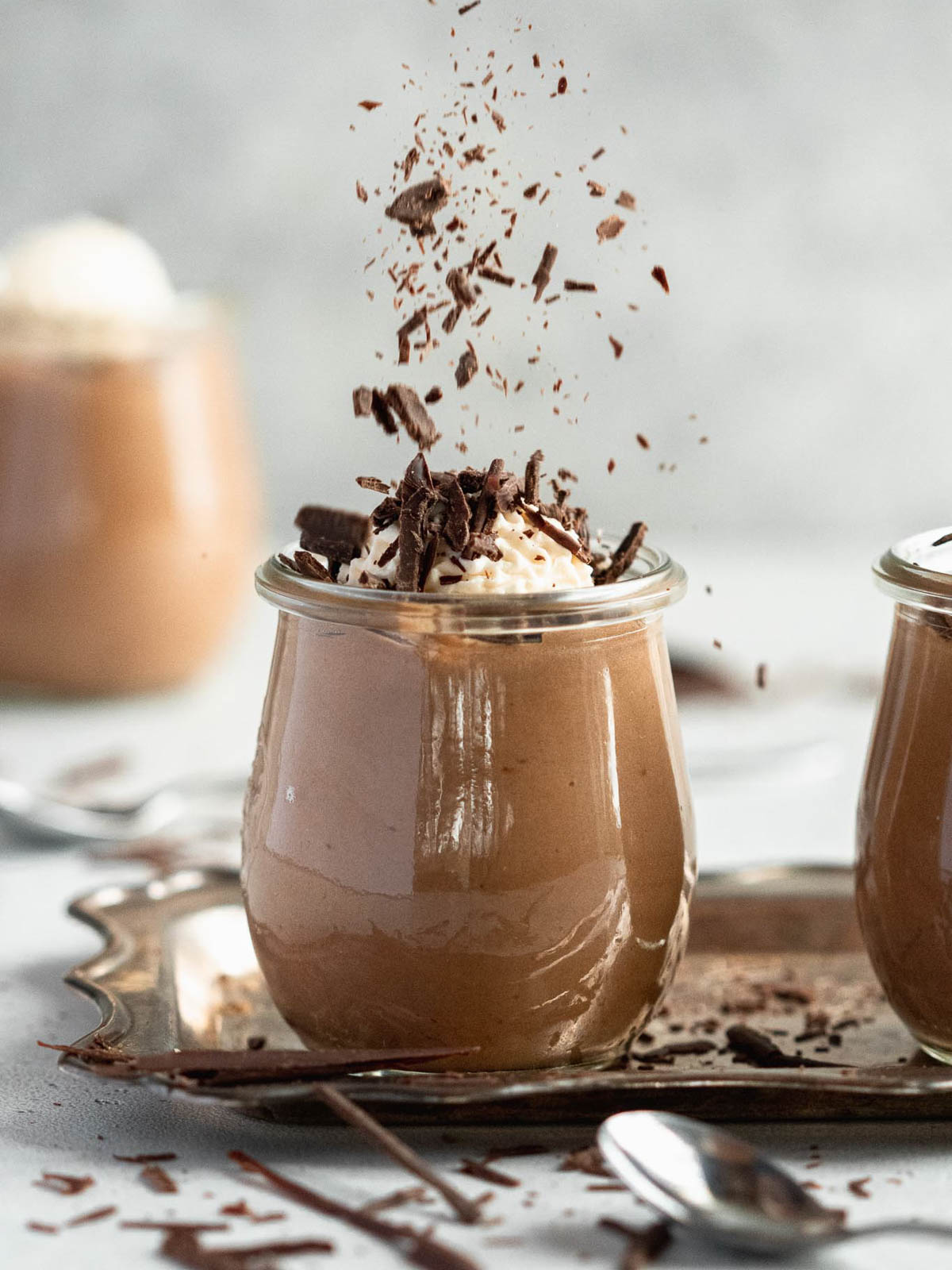 Light and airy no-bake Toblerone mousse in glass jars, ready to serve as an easy make-ahead dessert.