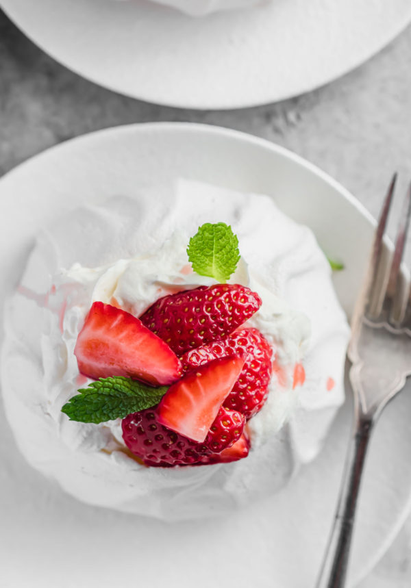 close up of pavlova with strawberries