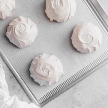 individual pavlovas on baking sheet