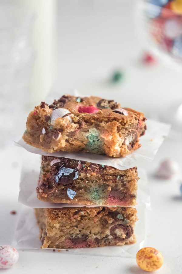 3 stacked easter egg blondies with a bite out of the top one