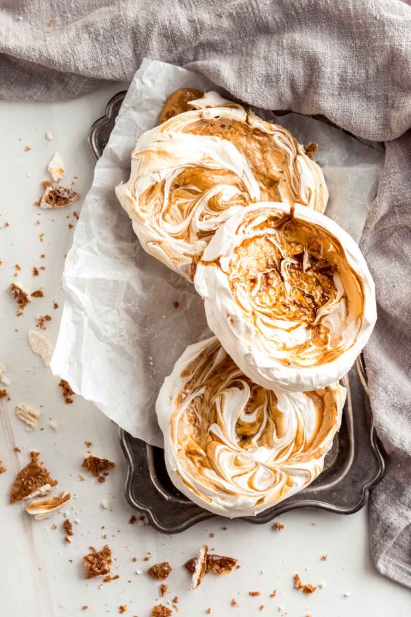 flatlay of salted caramel meringues on a tray