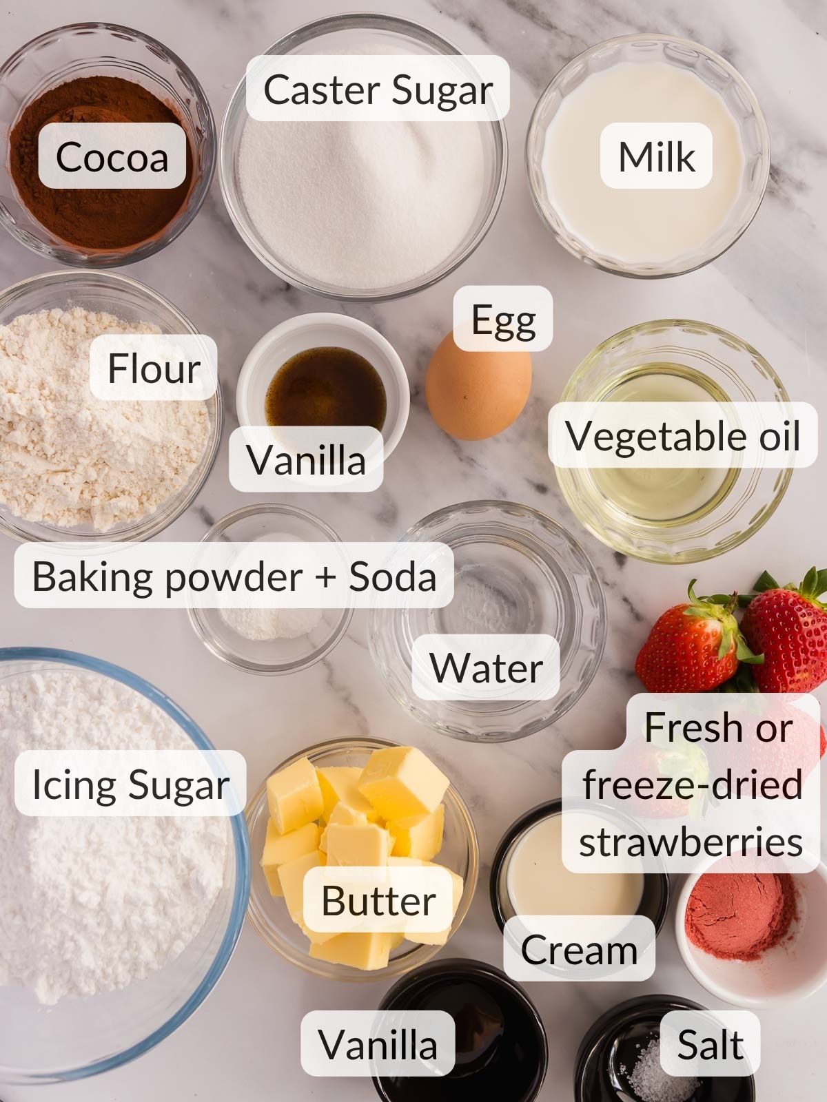 Ingredients needed to make mini chocolate cakes with strawberry frosting.