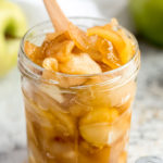 close up shot of caramel apples in a jam jar