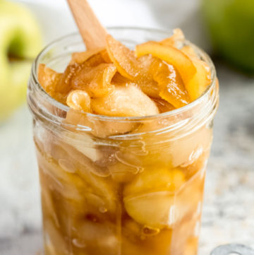 close up shot of caramel apples in a jam jar