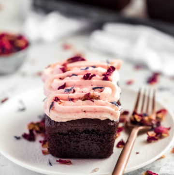 mini chocolate cake with pink frosting on a plate