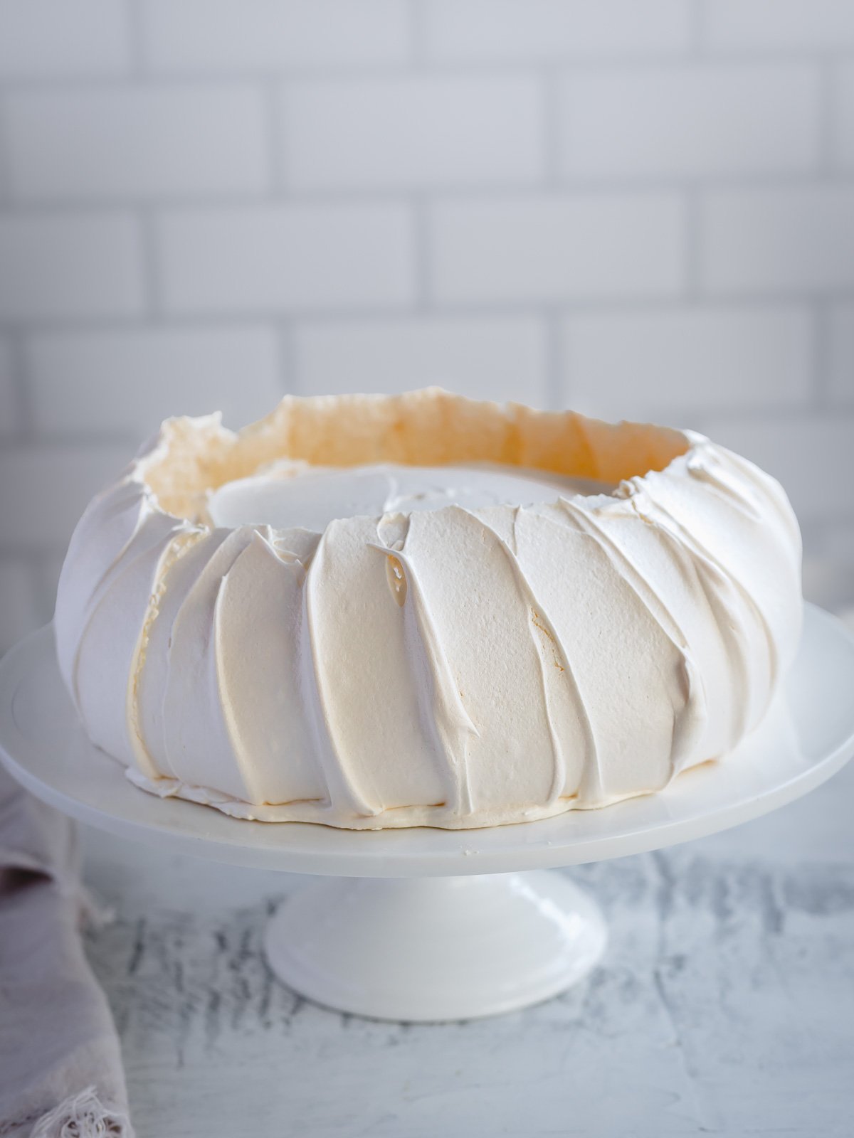 How to make a perfect pavlova, with a crisp shell and marshmallow centre.
Top it with cream and berries.
