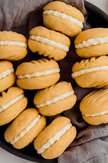 A tray of buttery yo yo biscuits, filled with a tangy lemon icing.