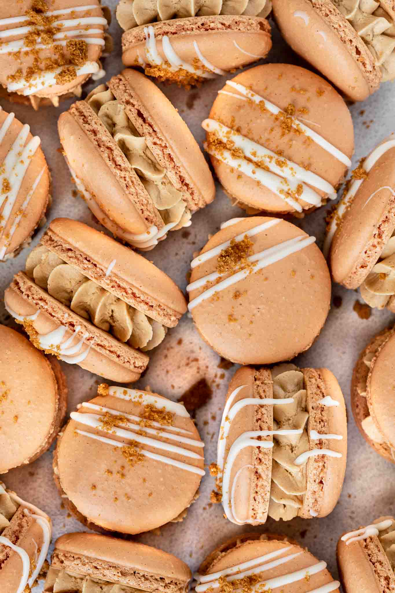 close up shot of biscoff macarons drizzled in white chocolate 