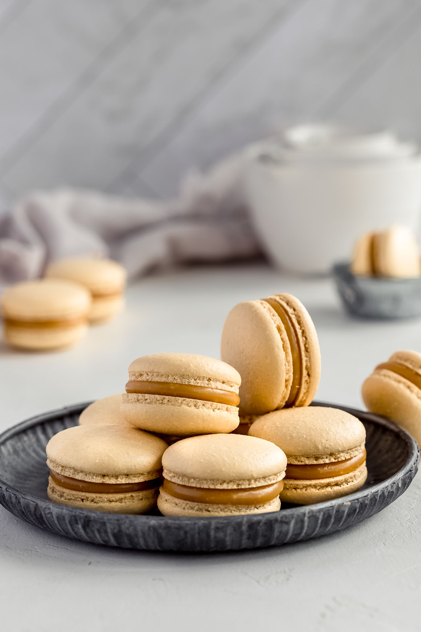 caramel French Macarons on a round vintage tray