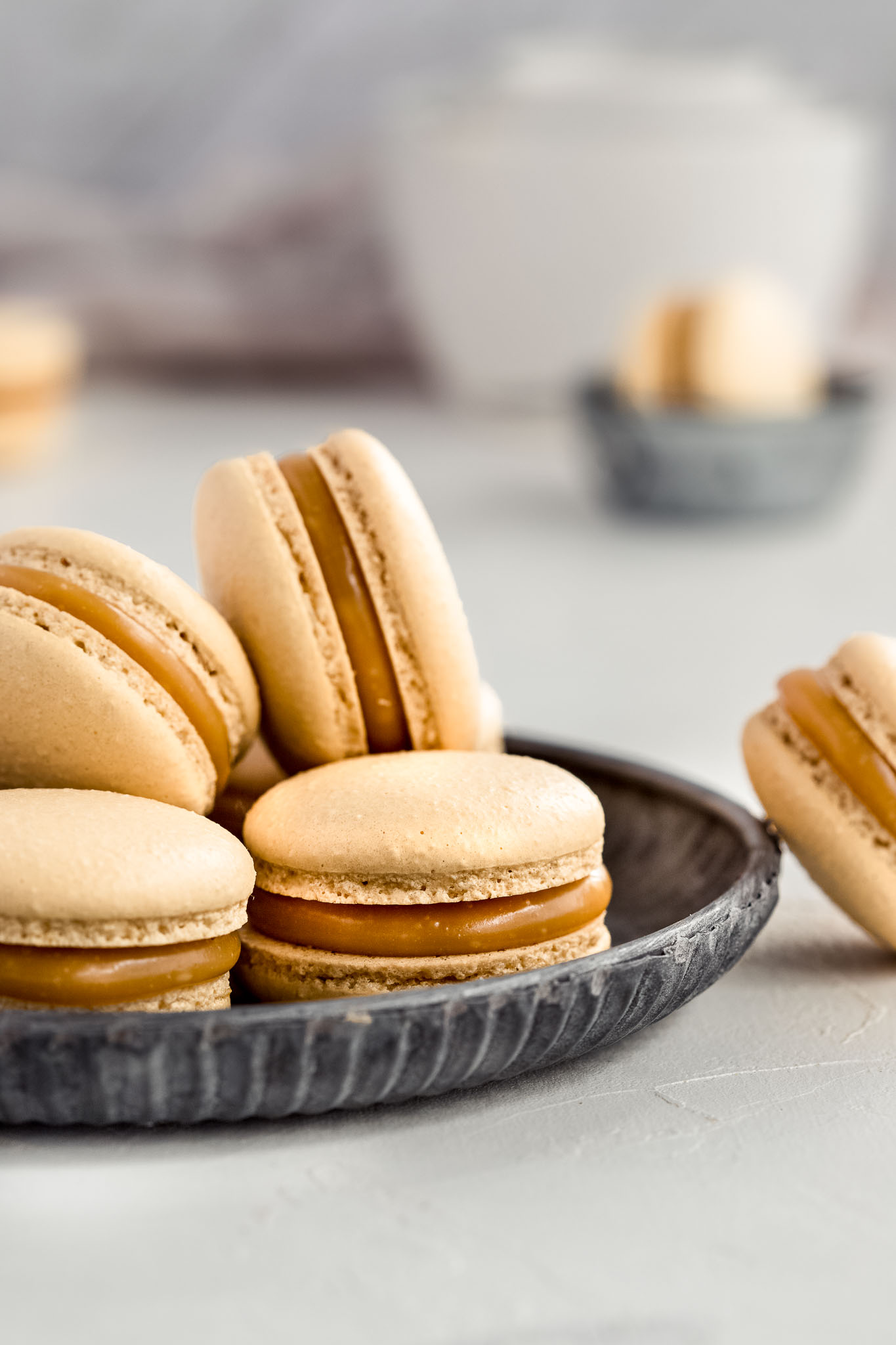 close up of French Macarons on a round vintage tray