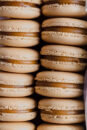 Rows of perfect French macarons, filled with salted caramel.