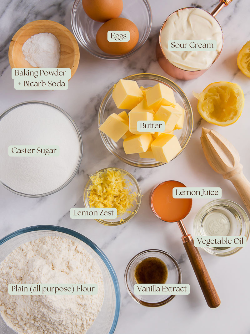 ingredients used to make easy lemon sour cream cake, placed into individual bowls