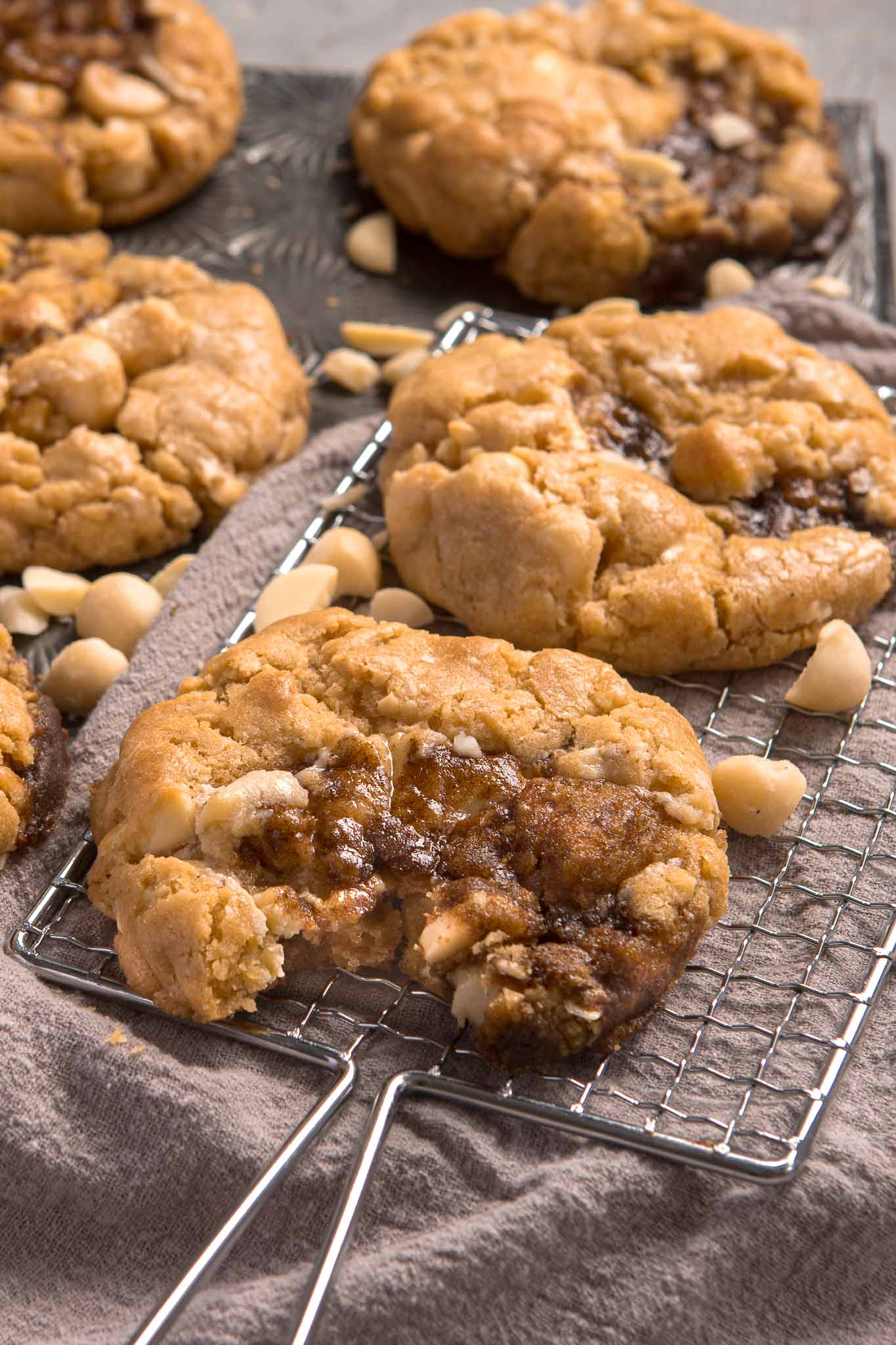 close up bite shot of a gooey cinnamon scroll cookie