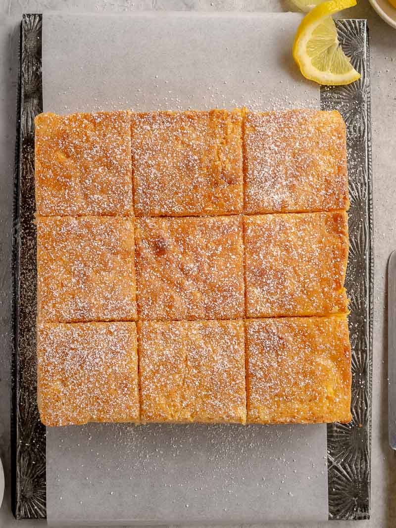 plain lemon cake, dusted with icing sugar and cut into 9 squares