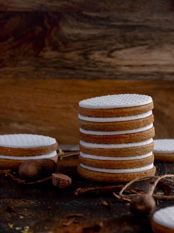 a stack of speculaas sugar cookies that have been decorated with fondant