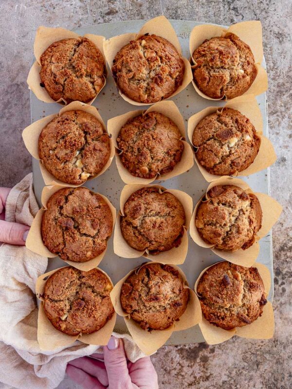 a tray of 12 baked biscoff muffins, straight out of the oven