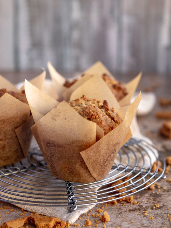 Close up of a biscoff muffin inside a brown paper tulip muffin case