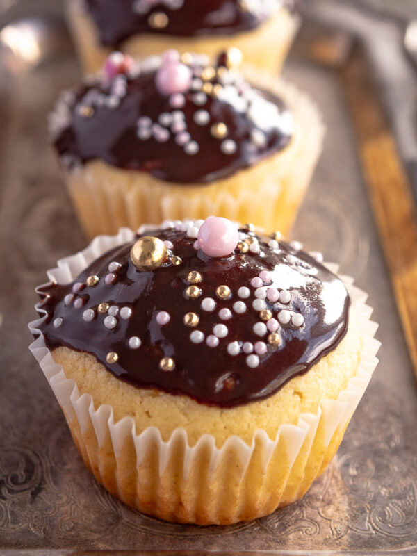 3 patty cakes glazed with chocolate icing