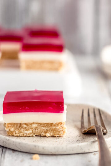 a square of jelly slice on a small plate