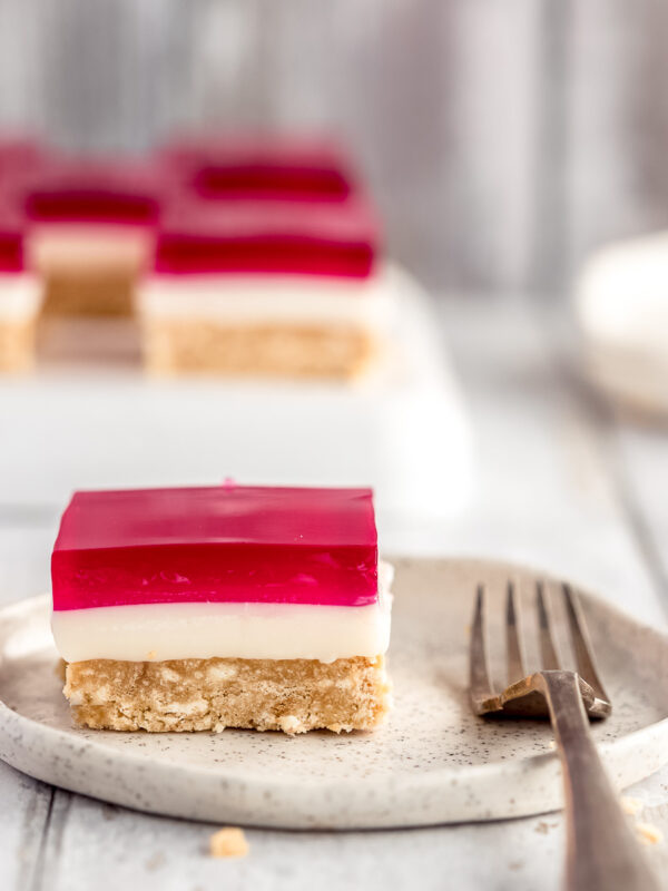 a square of jelly slice on a small plate