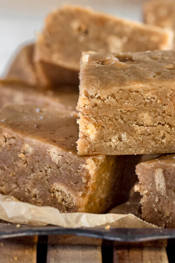 Squares of fudgy caramel slice.