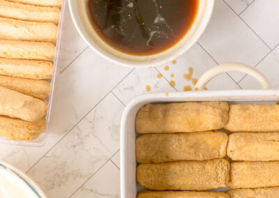 line the base of serving dish with dipped lady fingers