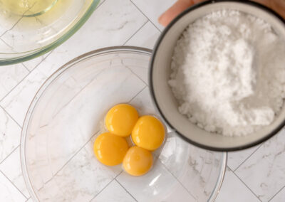 add sugar to the yolks