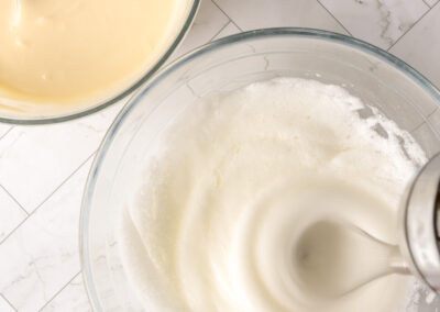 in a separate bowl, whisk the egg whites