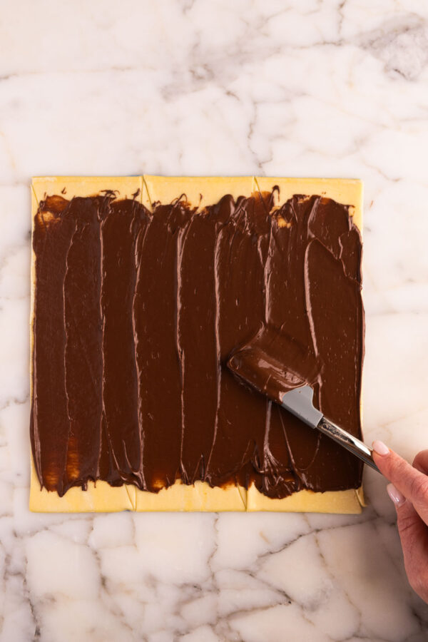 spread pastry with a layer of chocolate spread