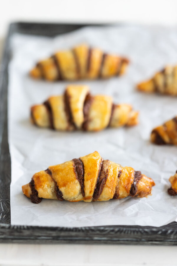 3 mini chocolate croissants on a tray