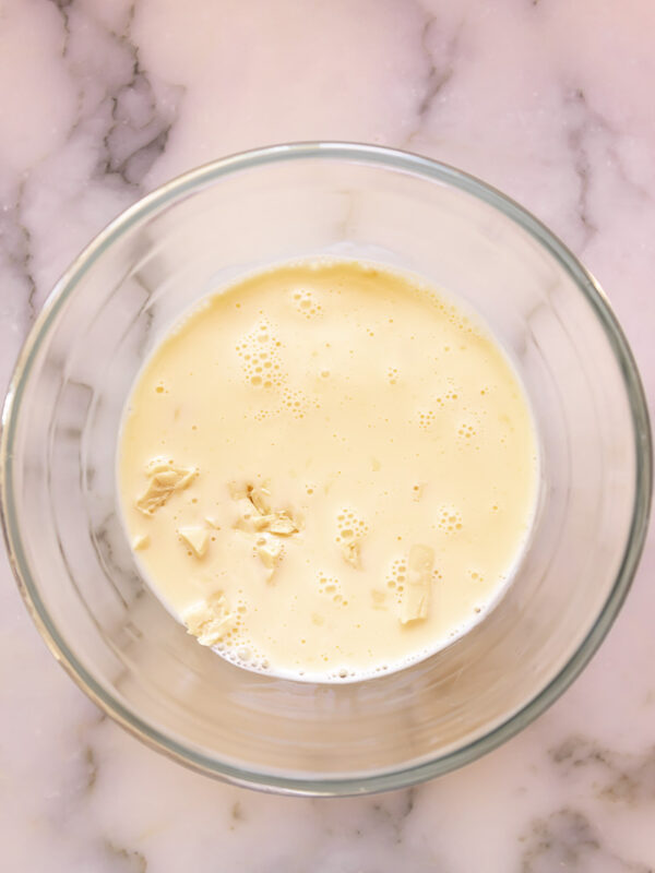 hot cream poured over chopped white chocolate