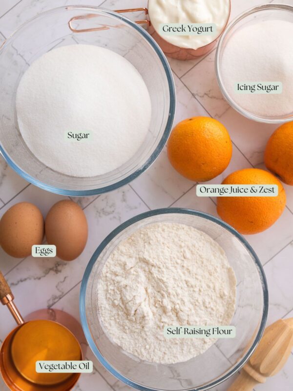 flatlay of ingredients used to make an orange cake