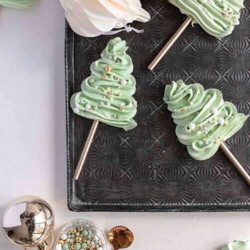 meringue Christmas trees piped onto a lollypop stick