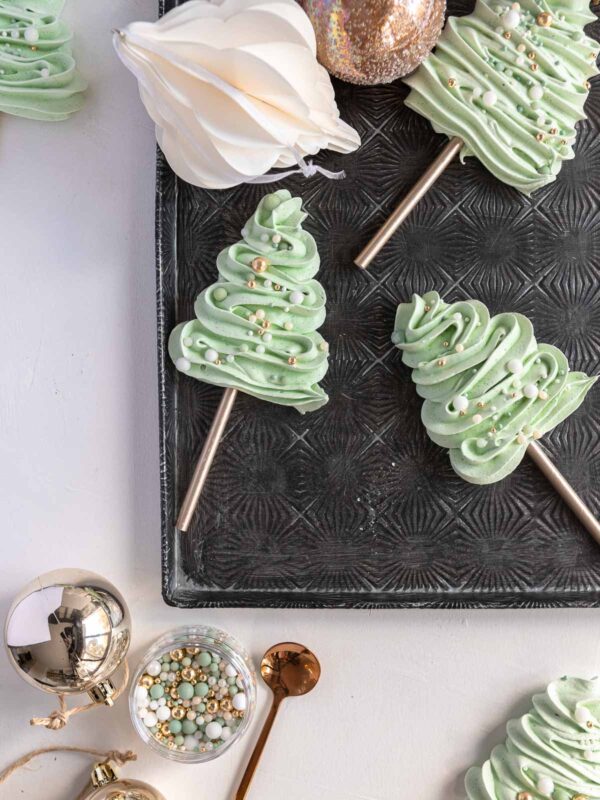 meringue Christmas trees piped onto a lollypop stick