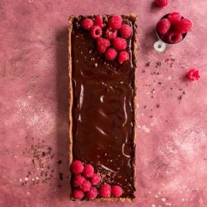 A simple but delicious chocolate raspberry tart, made with crushed Tim Tam biscuits.
