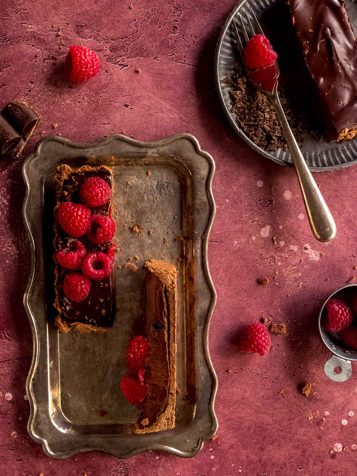 Process shot for a chocolate and raspberry tart.