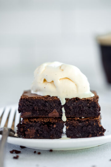 two brownie bars with a scoop of vanilla ice cream