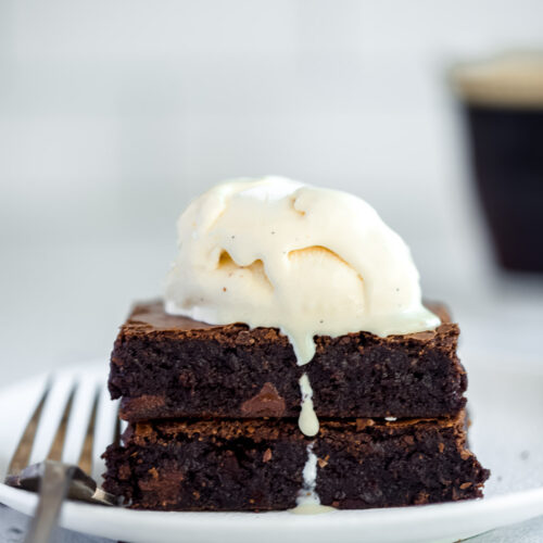 two brownie bars with a scoop of vanilla ice cream