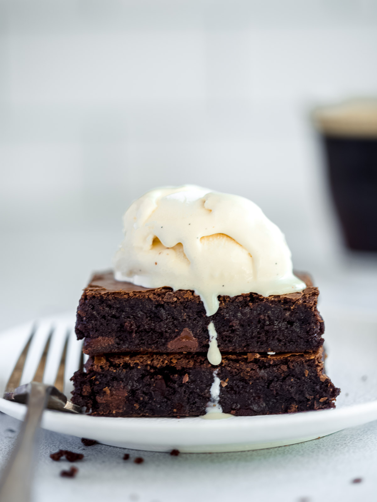 two brownie bars with a scoop of vanilla ice cream